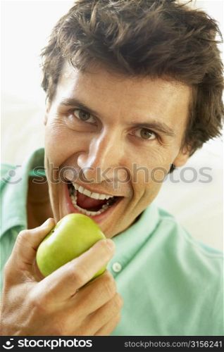 Mid Adult Man Eating A Healthy Apple