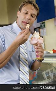 Mid adult man eating an ice cream