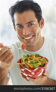 Mid Adult Man Eating Salad