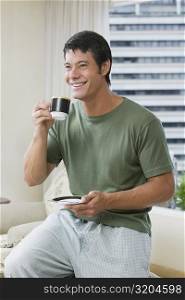 Mid adult man holding a cup of tea