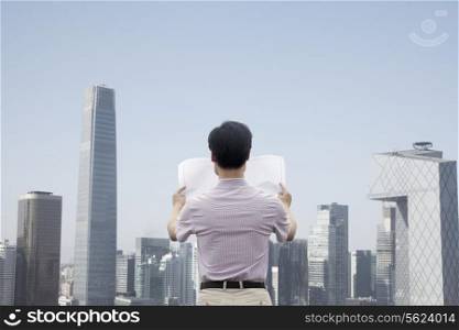 Mid Adult Man In Front Of Cityscape