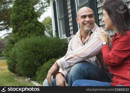 Mid adult man looking at a mature woman and smiling