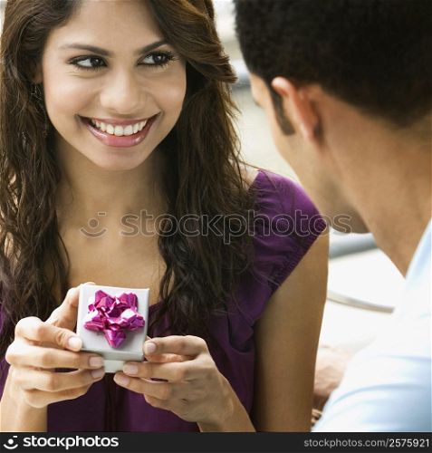 Mid adult man proposing to a young woman