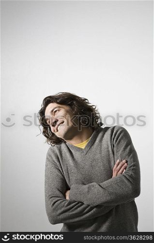 Mid-adult man smiling, studio shot