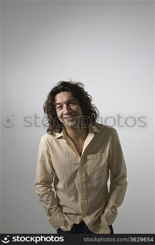 Mid-adult man smiling, studio shot