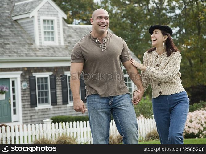 Mid adult man smiling with a mature woman
