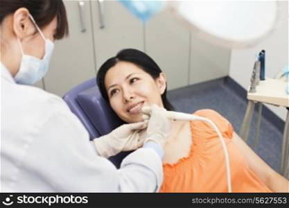 Mid Adult Woman At Dentist