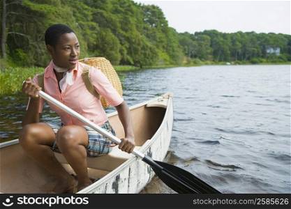 Mid adult woman canoeing