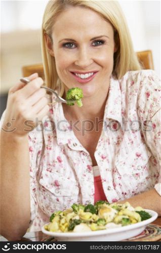 Mid Adult Woman Eating A Healthy Meal