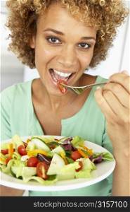 Mid Adult Woman Eating A Salad