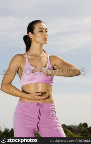 Mid adult woman exercising