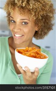 Mid Adult Woman Holding A Bowl Of Carrots