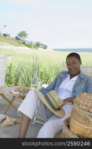 Mid adult woman holding a glass of wine and smiling