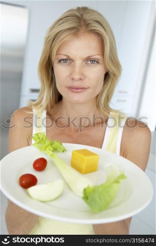 Mid Adult Woman Holding A Plate Of Healthy Food