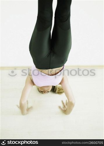 Mid adult woman in a yoga pose