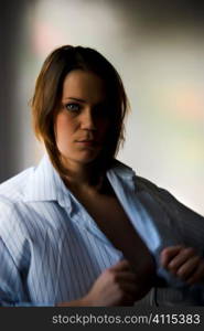 Mid-adult woman in man's shirt