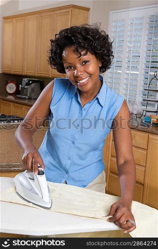 Mid-adult woman ironing