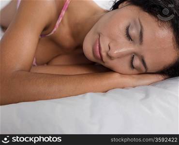 Mid-adult woman sleeping, head and shoulders
