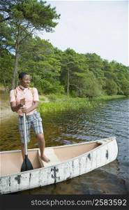 Mid adult woman standing on a boat and smiling