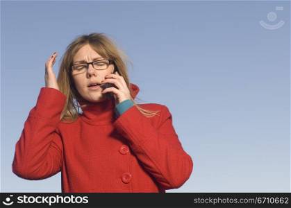 Mid adult woman talking on a mobile phone