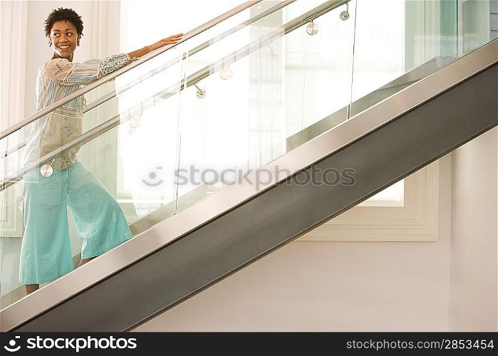 Mid-adult woman walking up stairs