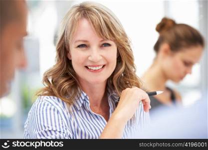 Mid age businesswoman in meeting