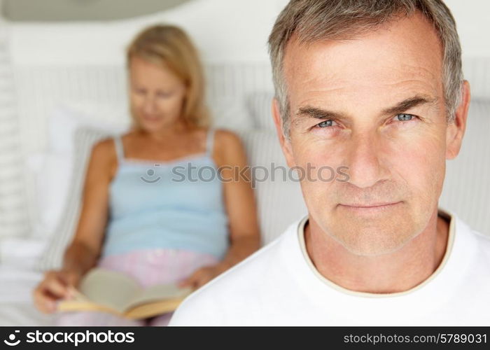 Mid age couple in bedroom