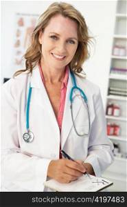 Mid age female doctor writing prescription