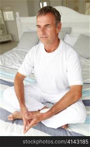 Mid age man in lotus position