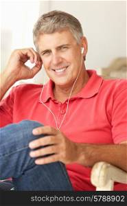 Mid age man wearing earphones