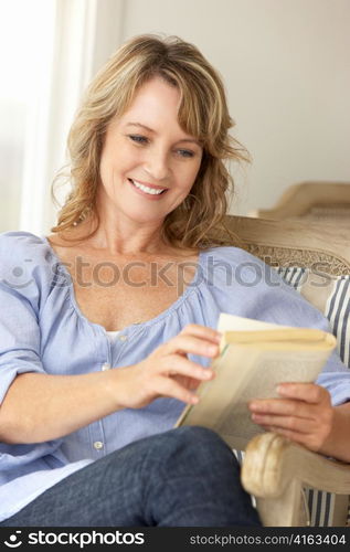 Mid age woman reading a book