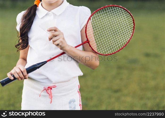 mid section girl holding shuttlecock badminton hand