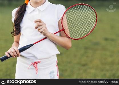 mid section girl holding shuttlecock badminton hand