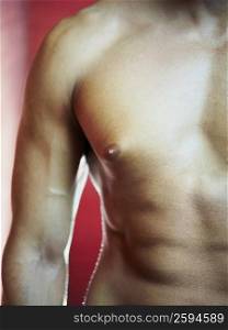 Mid section view of a bare chested man