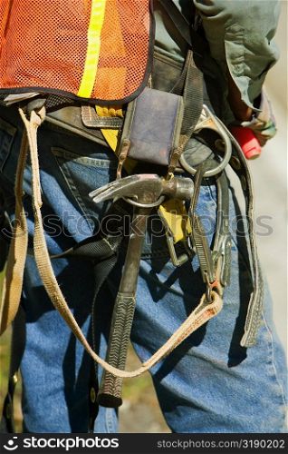 Mid section view of a construction worker