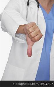 Mid section view of a male doctor showing a thumbs down sign