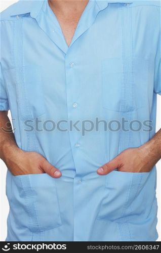 Mid section view of a male nurse with his hands in his pockets