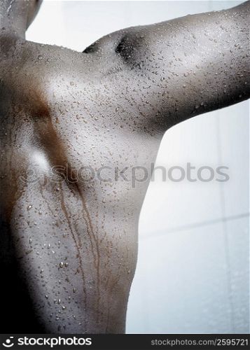 Mid section view of a man taking a bath