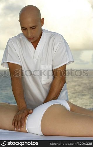 Mid section view of a woman getting a back massage