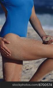 Mid section view of a woman in a swimsuit