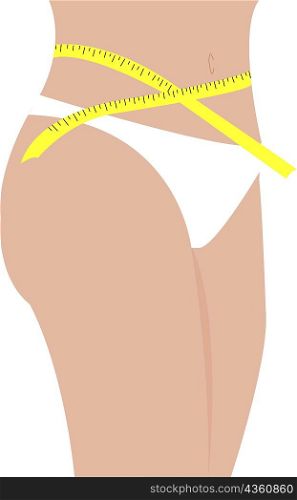 Mid section view of a woman measuring her waist