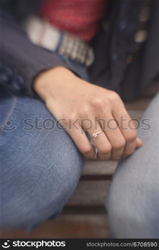 Mid section view of a woman sitting with a man
