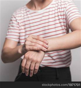 mid section young woman having pain wrist. High resolution photo. mid section young woman having pain wrist. High quality photo