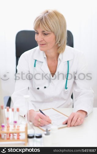 Middle age female doctor at working