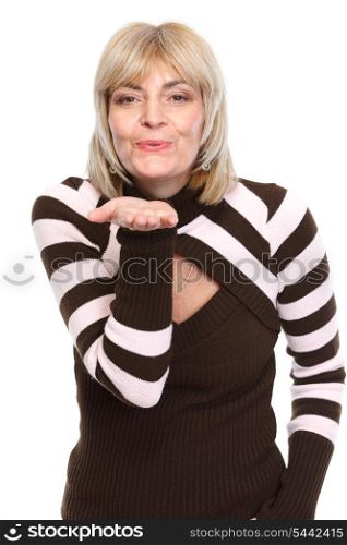 Middle age woman blowing air kiss