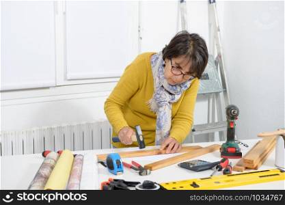 middle age woman doing DIY work at home