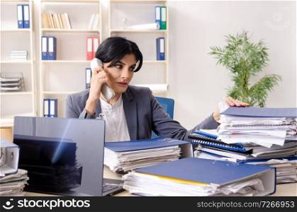 Middle aged businesslady unhappy with excessive work 