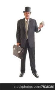 Middle aged businessman in a retro business suit with money isolated on white.