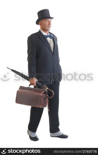 Middle aged businessman in a retro business suit with valise and umbrella isolated on white