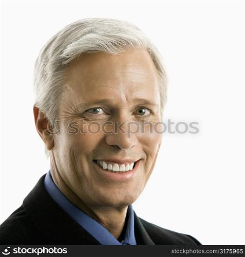 Middle aged Caucasian man in business suit smiling at viewer.